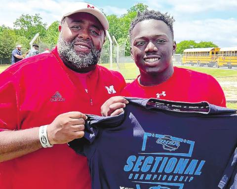 Jacere Cooper (left) and MCHS throwing coach Kenneth Vaughn (right) after his fourth-place finish at the Class AAA sectionals. CONTRIBUTED