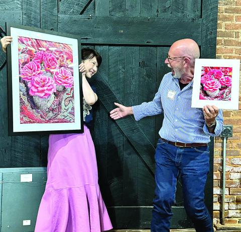 Artist Leslie Guo and photographer Lee Manis share a laugh over their contributions, both titled “Petite Roses.” CONTRIBUTED