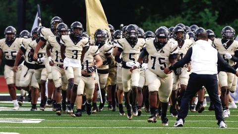 The Greene County Tigers take the field ahead of their game against Twiggs County last week. LANCE McCURLEY/Staff