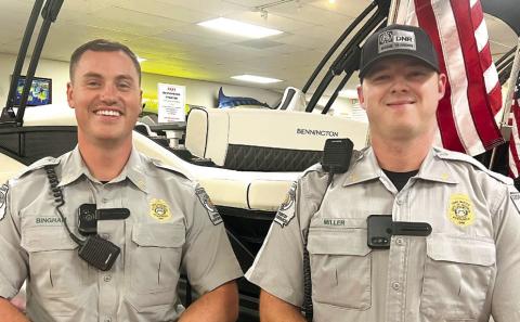 Georgia DNR Game Wardens Taylor Bingham (left) and Mason Miller conducted a safe boater class last month at Crowe Marine in Putnam County. IAN TOCHER/Staff