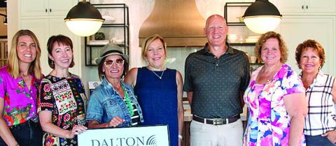 L-R: Candi White, Keri Dunn, Casey Jo Hanson, and Diana Risher of Dalton Carpet One, along with Patrick Kozma, Elaine Mathew, and Jan Broughton of Greene County Habitat for Humanity. CONTRIBUTED