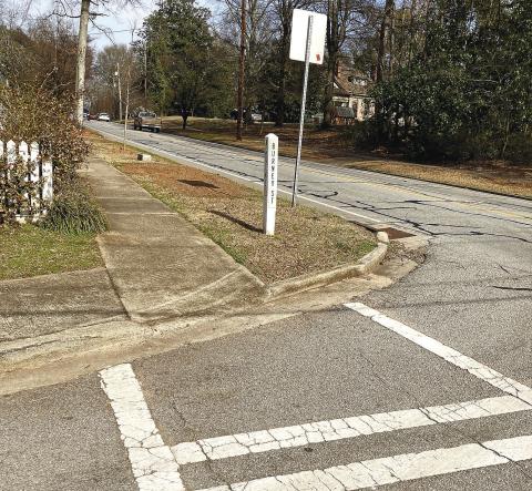 Several roads intersecting Main Street in Madison are in need of attention. T. MICHAEL STONE/Staff
