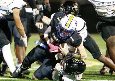 A Greene County defender sacks Lake Oconee Academy quarterback Jake McDonald (1). LANCE McCURLEY/Staff