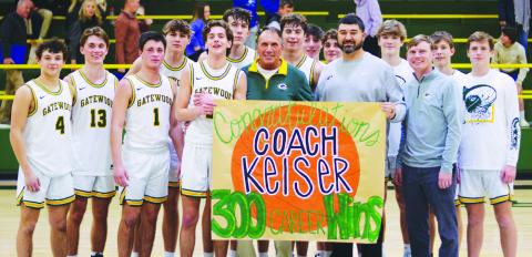 Gatewood head coach Don Keiser (green shirt) enjoyed a moment with his players, including his son, Kaden (13), after they delivered his 300th career win with a 72-53 finish over the visiting Trinity Christian Crusaders. IAN TOCHER/Staff