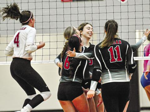Morgan County’s team celebrating at center court after one of its regular season win over Oconee County earlier this year. CHARLES JORDAN/Staff