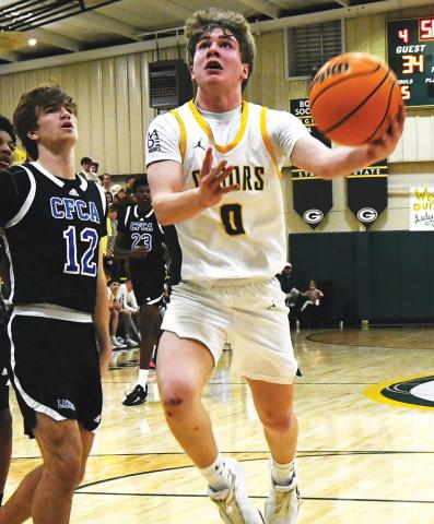 Then an eighth grader, Bennett Haley attempts a layup through traffic during a game in the 2025-26 season. IAN TOCHER/Staff