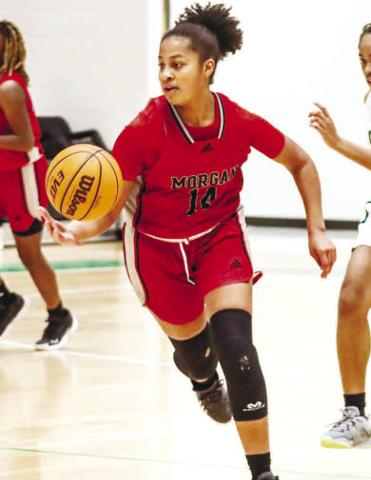 Lady Dogs sophomore Jaden Young (14) takes the ball at the top of the key against LANCE McCURLEY/Staff