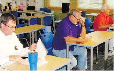 From left, Greene County Board of Education District 4 member Perry Lee, District 1 member Steve Kilgore and BOE Chair Mike Lynch attended the Monday LOA board meeting. MARK ENGEL/Staff