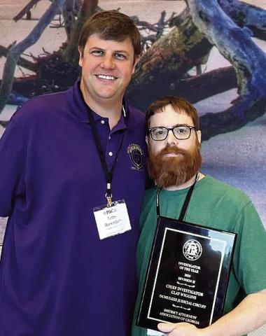 Investigator Clay Wiggins (right) and Ocmulgee Circuit District Attorney Wright Barksdale after the award was announced. CONTRIBUTED