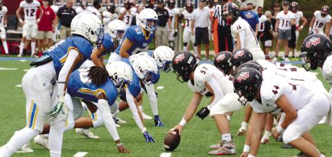 Lake Oconee Academy’s front seven lines up across from George Walton Academy’s o_ense ready to bring a blitz in the rst half of last week’s contest. BRENDAN KOERNER/Staff