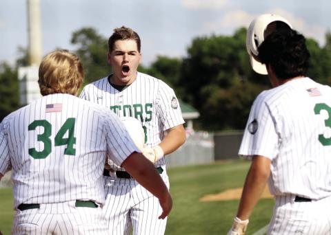 Gatewood’s Lawson Moore takes off his helmet and celebrates with teammates after hitting the second of his two home runs against Trinity Christian. TREY NORRIS/Staff