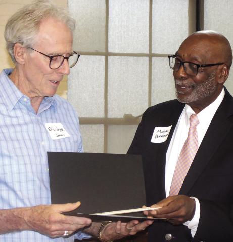 Erice Joyce receives the Volunteer of the Year award from Mayor Fred Perriman. (T. MICHAEL STONE/STAFF)