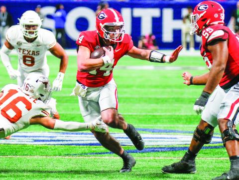 Gunner Stockton (14) will start at quarterback for Georgia against Notre Dame in the Allstate Sugar Bowl on Jan. 1. LANCE McCURLEY/Staff