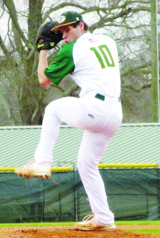 Wilson Moore (10) gets set from the bump as he prepares to deliver a pitch. TREY NORRIS/Staff