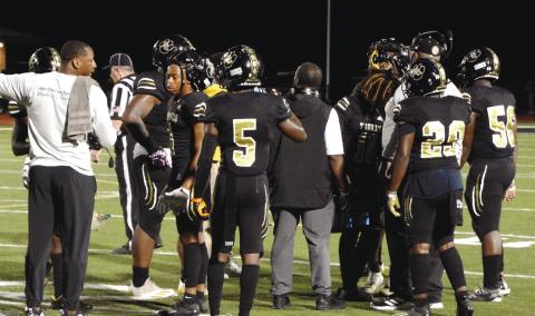 Tigers’ head coach Terrance Banks calls a timeout to talk things over with his defense. BRENDAN KOERNER/Staff