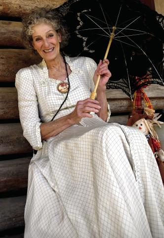 Virginia Linch of Butterflies and Blooms at the Briarpatch, welcomed guests to one of Stepback’s numerous log cabins. IAN TOCHER/Staff