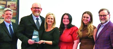 E-PCOC President Robbie King (far left) and Peoples Bank President Chuck Haley (far right) presented the 2026 Business of the Year Award to Keith Fitzgerald, founder and owner of ProSouth Services Electrical-Heating and Air, with his family. IAN TOCHER/Staff