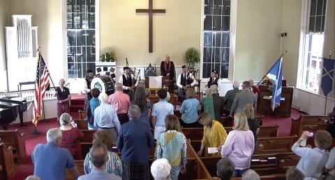 Bagpipers and drummers play a major role during the service. CONTRIBUTED