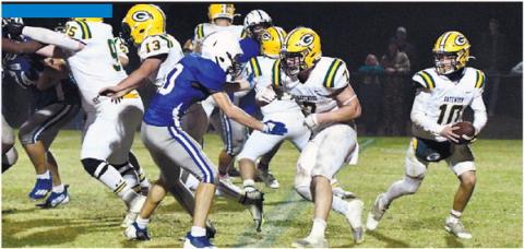 Gatewood quarterback Ames Johnson (10) scrambles behind his offensive line during the GIAA Class AA semifinal game Nov. 25, against Central Fellowship Christian Academy in Macon. DAWN SINCLAIR/Staff
