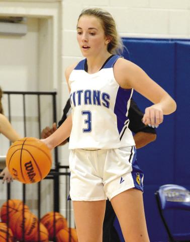 Senior Georgia Bosart (3) is one of the few Lady Titans returning from the past two state championship squads. Bosart helps bring the ball up the court as a point guard. BRENDAN KOERNER/Staff