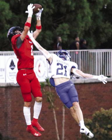 Morgan County wide receiver Ty Tillery (1) hauls in a touchdown pass over Oconee County cornerback TREY NORRIS/Staff