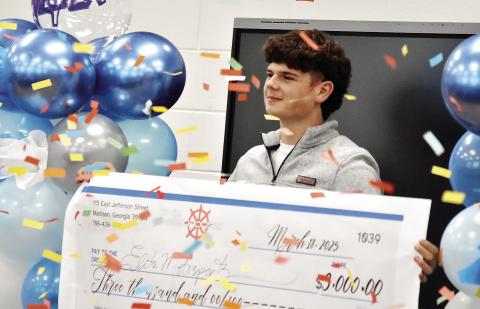 Morgan County High School junior Addison Hilsman is named the winner of the district-level Foundational Leadership and Entrepreneurship X-perience competition as confetti rains down. HANNAH BARRON/Staff