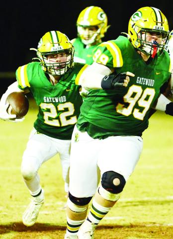 Gatewood's Hunter Johnson (22) runs behind his blockers. IAN TOCHER/Staff