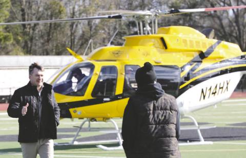 Georgia head coach Kirby Smart (left) greets Tigers’ head coach Terrance Banks (right) during a visit last Friday to Greene County High School. CONTRIBUTED
