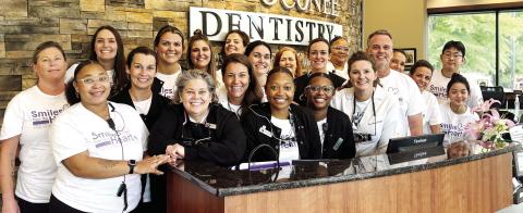 The team at Lake Oconee Dentistry during the annual Smiles from the Heart event Oct. 4. HANNAH BARRON/Staff