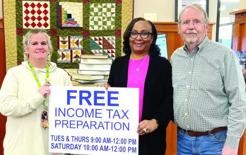 L-R: Greene County Library Branch Manager Tara Coile, Greene County Library Executive Director Targie Folds, and St. Vincent de Paul Vice President Mike Sleeth. CONTRIBUTED