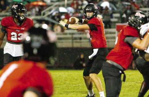 Morgan County quarterback Davis Strickland (5) passed for 185 yards and three touchdowns in the win over Greene County last Friday. (LANCE MCCURLEY/Staff)