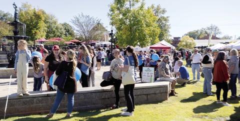 The fountain was a popular meeting spot in Madison Saturday during the Chili Cook Off and Fall Festival. LEIGH LOFGREN/Staff