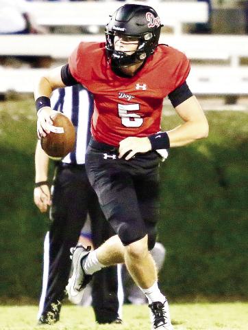 Morgan County quarterback Davis Strickland helped lead the Dogs to victory last week by completing 20 of 29 passes for 300 yards and four touchdowns. JIM TURNER/Contributed