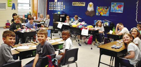 Third-grade business owners are ready for the customers in Dr. Rita Thomas’ classroom.