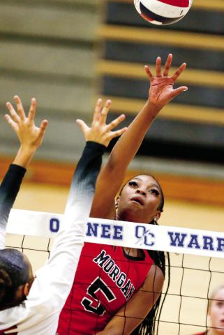 Senior E’mariona Johnson puts a ball back over the net. LANCE McCURLEY/Staff