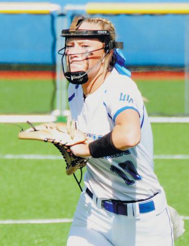 Lady Titans’ Jacy Singleton (10) winds up to pitch to a Washington-Wilkes batter in one of last year’s region contests against the Lady Tigers’. BRENDAN KOERNER/Staff