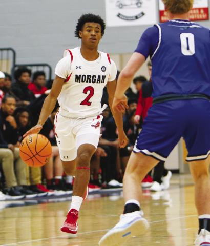 Morgan County’s Jacoby Simmons dribbles the ball up the floor in transition. LANCE McCURLEY/Staff