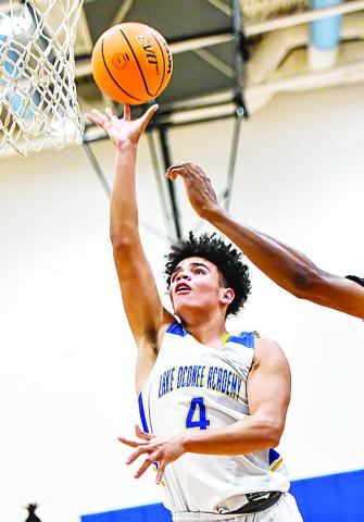 Freshman Keenan Parham (4) goes up for a layup in Tuesday’s loss to Lamar County. CHARLES JORDAN/Staff