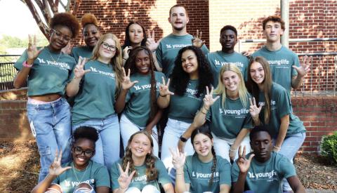 Greene County Young Life members hold up three fingers each to represent the “Three L’s of Discipling” within the organization’s ministry, including the Person of Christ, the Work of Christ, and the Invitation of Christ. CONTRIBUTED