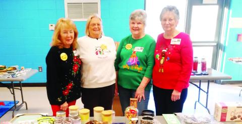 L-R: Judy Fain, Linda Pressley, Gail Mills and Leonell Alligood work as Santa’s helpers at Santa’s Secret Workshop. CONTRIBUTED