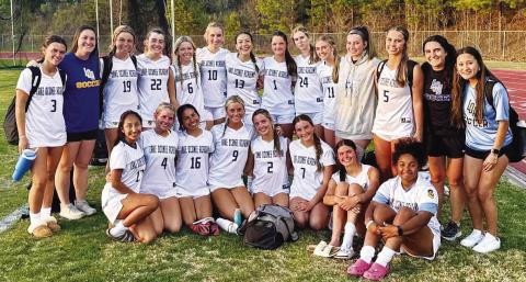 The Lake Oconee Academy girls soccer team poses for a photo after defeating Lincoln County 4-1 on March 28 to secure the Region 8 A Division II championship. CONTRIBUTED