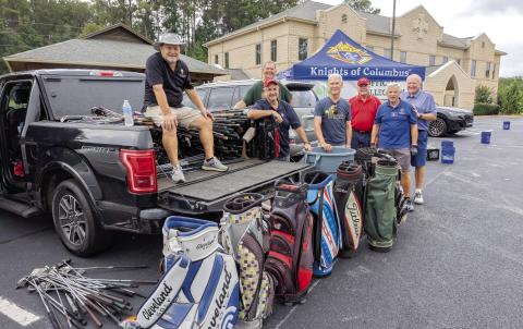 Jerry Stapp, Ernie Ceccato, Greg Haas, Paul Nickel, Chris Wolf, Ed Zaucha and Jerry Nicholson with some of the golf equipment going to Bunkers in Baghdad. LEIGH LOFGREN/Staff