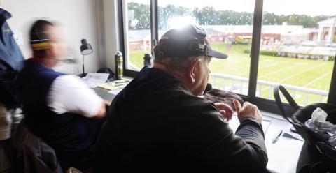 Putnam County assistant coach Charlie Winslette sits in the visiting coaches box at Morgan County High School in Madison, on Aug. 22. Winslette has been coaching high school football for 52 years. Abbey Cutrer/AJC