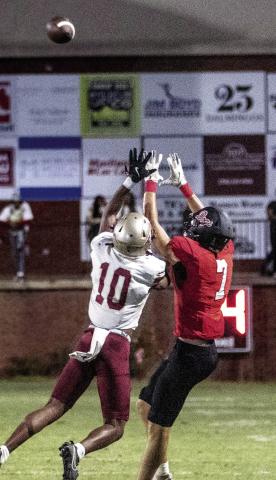 Morgan County wide receiver Wyatt Singleton (7) attempts to haul in a pass over Westside defensive back Syveon Hodges (10). SKYLA MORRIS/Staff