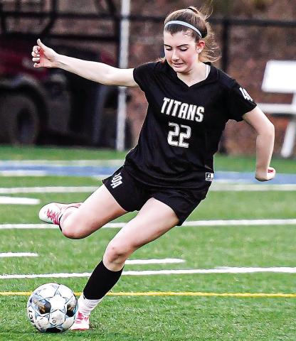 LOA senior Lauren Glass gets set to kick the ball downfield during an offensive possession CHARLES JORDAN/Staff