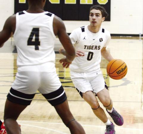Greene County senior Ryder Eschbach (0) drives the lane during the second quarter of a game against Taliaferro County on Friday, Dec. 20. IAN TOCHER/Staff