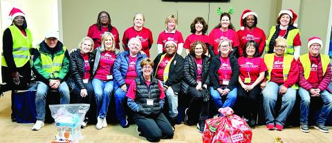 Victory Train volunteers work together to help spread Christmas cheer. CONTRIBUTED