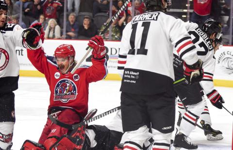 Garrett Milan, at 34, the oldest player on the Rock Lobsters’ roster, celebrates a third-period goal last Friday in the team’s 2025-26 season opener at Akins Ford Arena in Athens. IAN TOCHER/Staff
