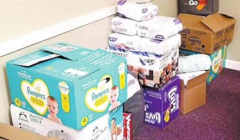 Diapers are stacked and ready to be given to families in need. CONTRIBUTED