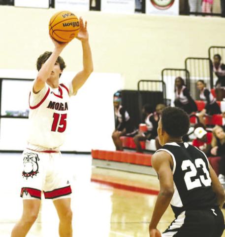 Morgan County senior Harrison Peaster (15) lines up a 3-pointer in a region game against Hephzibah last Friday. LANCE McCURLEY/Staff